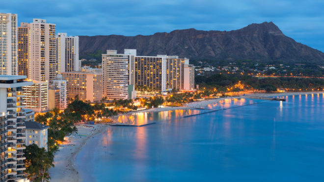 Scenic view of Honolulu city Diamond Head and Waikiki Beach at night; Hawaii USA