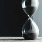Hourglass on a stark background, symbolizing Four Months Left in the year plan.